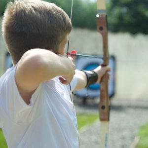 Boy doing archery at a Wood N Wheels centre 